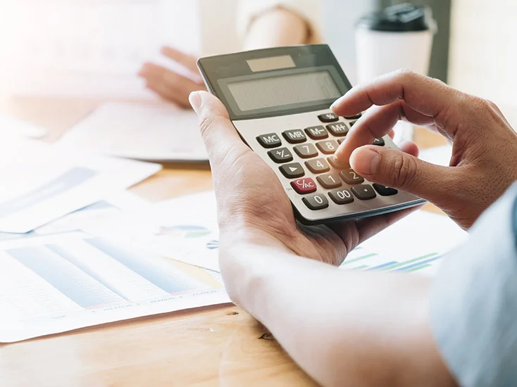 Calculator and documents on a desk